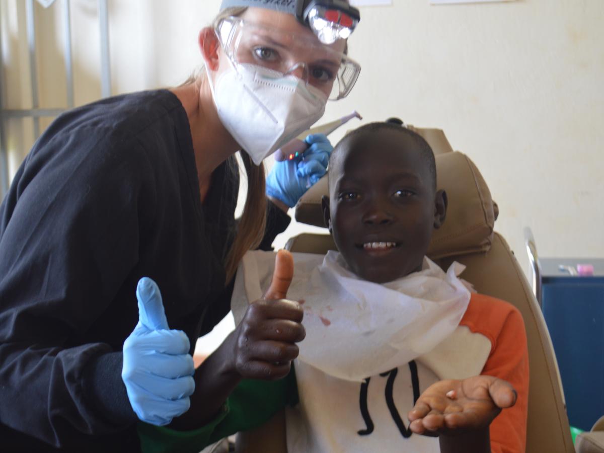 Medical camp volunteer with child